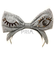 Load image into Gallery viewer, RIBBED BOW HEADBAND WITH FOIL WINK